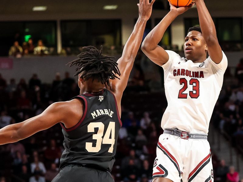 Jan 14, 2023; Columbia, South Carolina, USA; South Carolina Gamecocks forward Gregory Jackson II (23) shoot over Texas A&M Aggies forward Julius Marble (34) in the first half at Colonial Life Arena. Mandatory Credit: Jeff Blake-USA TODAY Sports