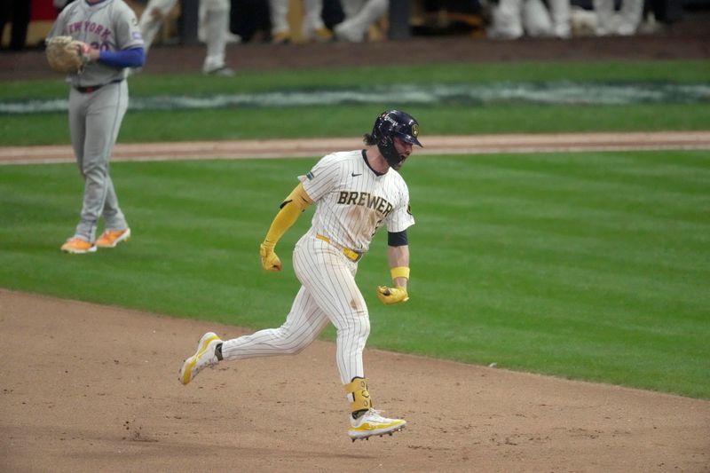 Oct 2, 2024; Milwaukee, Wisconsin, USA; Milwaukee Brewers outfielder Garrett Mitchell (5) reacts after hitting a two-run home run during the eighth inning against the New York Mets in game two of their wild-card playoff game at American Family Field. Mandatory Credit: Mark Hoffman-Imagn Images