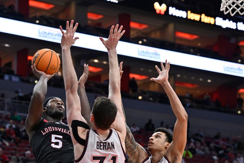 Mar 5, 2024; Louisville, Kentucky, USA; Louisville Cardinals forward Brandon Huntley-Hatfield (5) shoots against Virginia Tech Hokies forward Robbie Beran (31) and center Lynn Kidd (15) during the second half at KFC Yum! Center. Virginia Tech defeated Louisville 80-64. Mandatory Credit: Jamie Rhodes-USA TODAY Sports