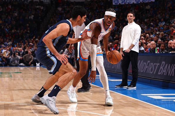 OKLAHOMA CITY, OK - DECEMBER 18:  Shai Gilgeous-Alexander #2 of the Oklahoma City Thunder handles the ball during the game against the Memphis Grizzlies on December 18, 2023 at Paycom Arena in Oklahoma City, Oklahoma. NOTE TO USER: User expressly acknowledges and agrees that, by downloading and or using this photograph, User is consenting to the terms and conditions of the Getty Images License Agreement. Mandatory Copyright Notice: Copyright 2023 NBAE (Photo by Zach Beeker/NBAE via Getty Images)