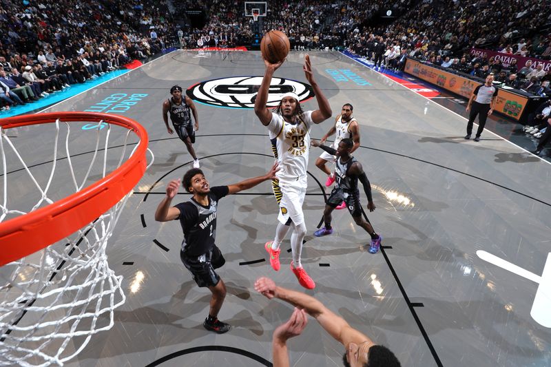 BROOKLYN, NY - DECEMBER 4: Myles Turner #33 of the Indiana Pacers shoots the ball during the game against the Brooklyn Nets on December 4, 2024 at Barclays Center in Brooklyn, New York. NOTE TO USER: User expressly acknowledges and agrees that, by downloading and or using this Photograph, user is consenting to the terms and conditions of the Getty Images License Agreement. Mandatory Copyright Notice: Copyright 2024 NBAE (Photo by Jeff Haynes/NBAE via Getty Images)