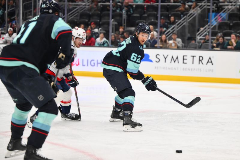 Jan 23, 2025; Seattle, Washington, USA; Seattle Kraken defenseman Brandon Montour (62) passes the puck during the second period against the Washington Capitals at Climate Pledge Arena. Mandatory Credit: Steven Bisig-Imagn Images