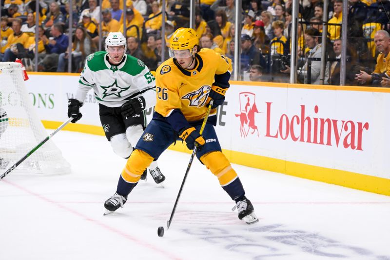 Oct 10, 2024; Nashville, Tennessee, USA; Nashville Predators center Philip Tomasino (26) skates against the Dallas Stars during the first period at Bridgestone Arena. Mandatory Credit: Steve Roberts-Imagn Images