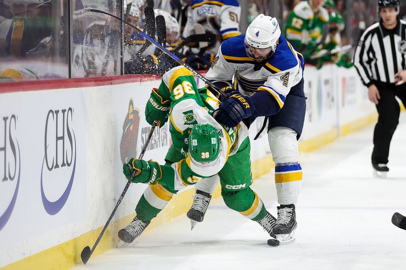 Mar 23, 2024; Saint Paul, Minnesota, USA; St. Louis Blues defenseman Nick Leddy (4) checks Minnesota Wild right wing Mats Zuccarello (36) during the second period at Xcel Energy Center. Mandatory Credit: Matt Krohn-USA TODAY Sports