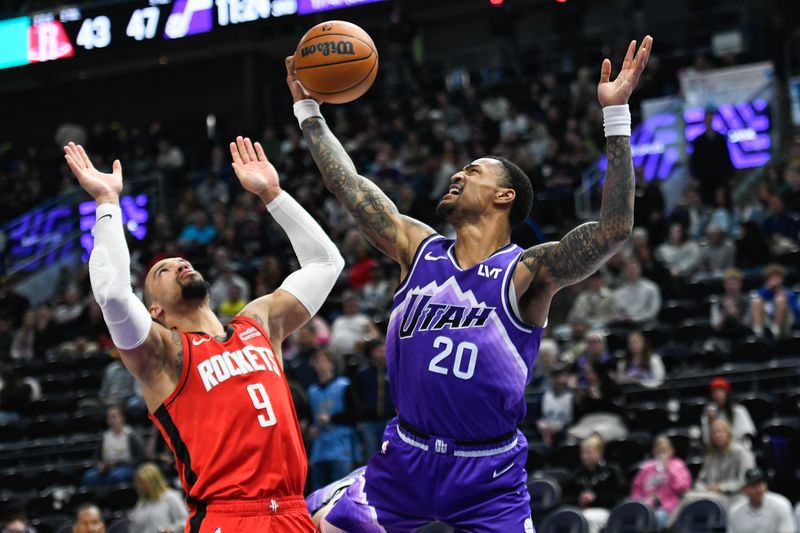 SALT LAKE CITY, UTAH - MARCH 29: John Collins #20 of the Utah Jazz shoots over Dillon Brooks #9 of the Houston Rockets during the second half of a game at Delta Center on March 29, 2024 in Salt Lake City, Utah. NOTE TO USER: User expressly acknowledges and agrees that, by downloading and or using this photograph, User is consenting to the terms and conditions of the Getty Images License Agreement.  (Photo by Alex Goodlett/Getty Images)