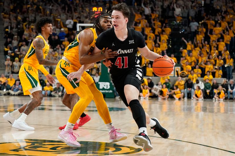 Jan 13, 2024; Waco, Texas, USA; Cincinnati Bearcats guard Simas Lukosius (41) works past  Baylor Bears guard Jayden Nunn (2) during the first half at Paul and Alejandra Foster Pavilion. Mandatory Credit: Raymond Carlin III-USA TODAY Sports