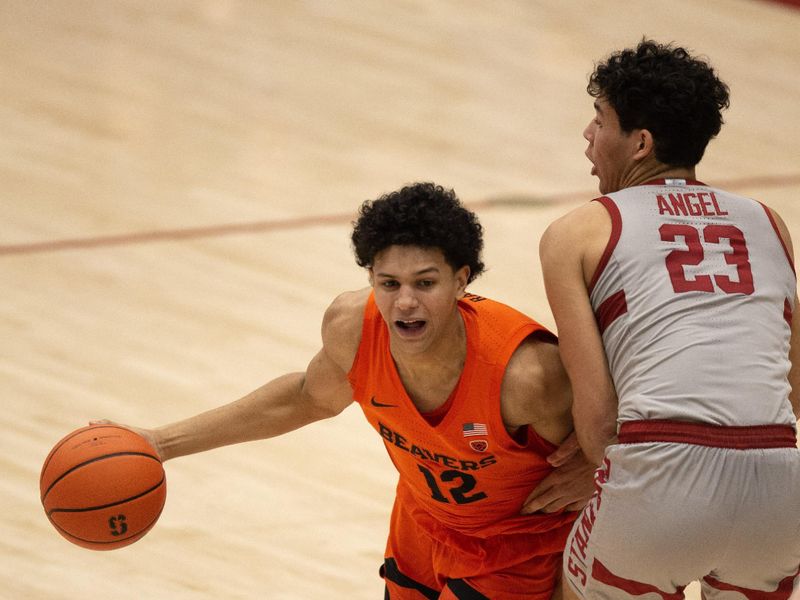 Jan 19, 2023; Stanford, California, USA; Oregon State Beavers forward Michael Rataj (12) drives around Stanford Cardinal forward Brandon Angel (23) during the second half at Maples Pavilion. Stanford defeated Oregon State 67-46. Mandatory Credit: D. Ross Cameron-USA TODAY Sports