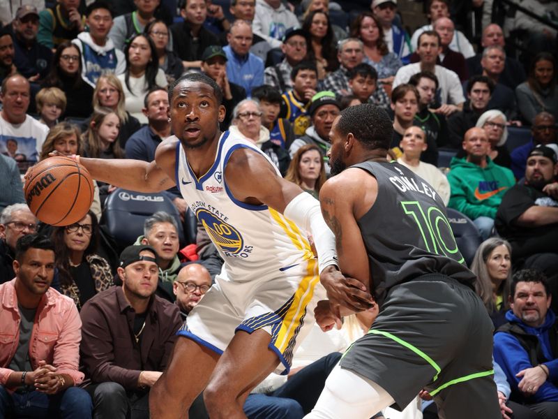 MINNEAPOLIS, MN -  MARCH 24: Jonathan Kuminga #00 of the Golden State Warriors handles the ball during the game against the Minnesota Timberwolves on March 24, 2024 at Target Center in Minneapolis, Minnesota. NOTE TO USER: User expressly acknowledges and agrees that, by downloading and or using this Photograph, user is consenting to the terms and conditions of the Getty Images License Agreement. Mandatory Copyright Notice: Copyright 2024 NBAE (Photo by David Sherman/NBAE via Getty Images)