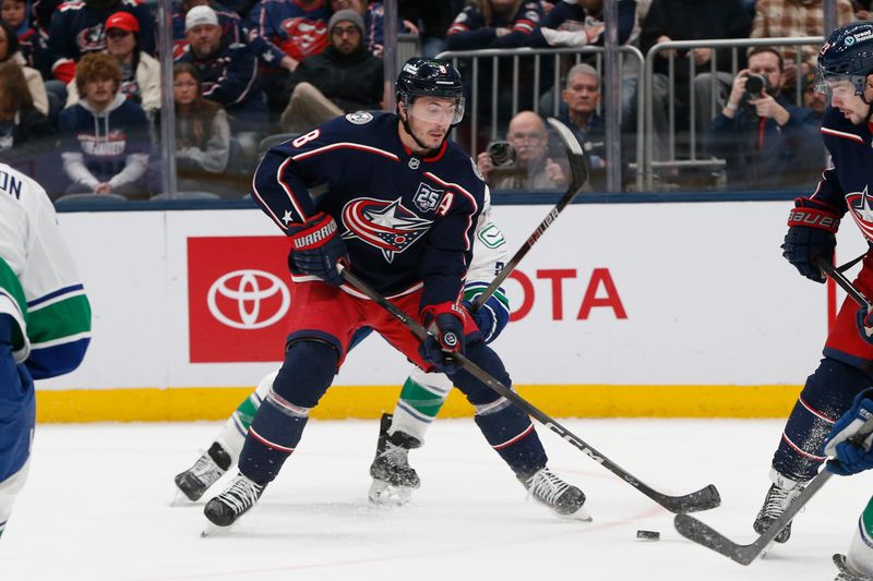Jan 15, 2026; Columbus, Ohio, USA; Columbus Blue Jackets defenseman Zach Werenski (8) looks to pass against the Vancouver Canucks during the second period at Nationwide Arena. Mandatory Credit: Russell LaBounty-Imagn Images