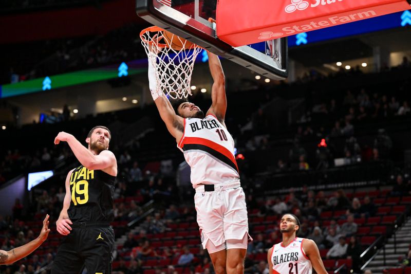 PORTLAND, OREGON - OCTOBER 18: Justin Minaya #10 of the Portland Trail Blazers dunks the ball during the fourth quarter of the preseason game against the Utah Jazz at Moda Center on October 18, 2024 in Portland, Oregon. NOTE TO USER: User expressly acknowledges and agrees that, by downloading and or using this photograph, User is consenting to the terms and conditions of the Getty Images License Agreement. (Photo by Alika Jenner/Getty Images)