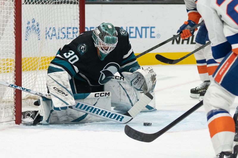 Mar 7, 2024; San Jose, California, USA; San Jose Sharks goaltender Magnus Chrona (30) defends the goal during the first period against the New York Islanders at SAP Center at San Jose. Mandatory Credit: Stan Szeto-USA TODAY Sports