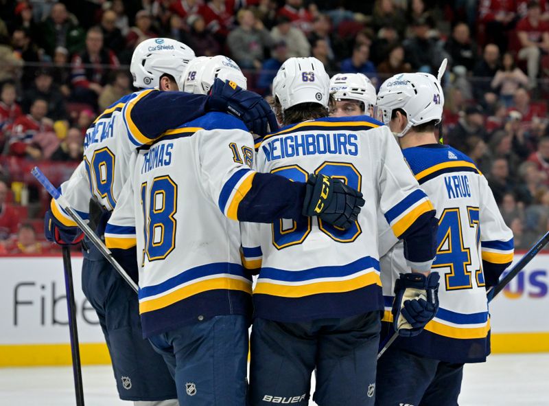 Feb 11, 2024; Montreal, Quebec, CAN; St.Louis Blues forward Jake Neighbours (63) celebrates with teammates after scoring a goal against the Montreal Canadiens during the third period at the Bell Centre. Mandatory Credit: Eric Bolte-USA TODAY Sports