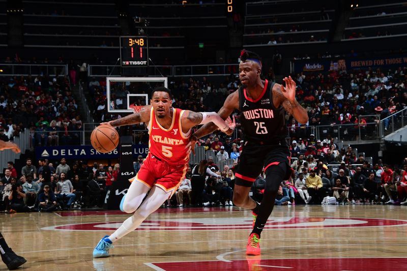 ATLANTA, GA - FEBRUARY 10: Dejounte Murray #5 of the Atlanta Hawks drives to the basket during the game against the Houston Rockets on February 10, 2024 at State Farm Arena in Atlanta, Georgia.  NOTE TO USER: User expressly acknowledges and agrees that, by downloading and/or using this Photograph, user is consenting to the terms and conditions of the Getty Images License Agreement. Mandatory Copyright Notice: Copyright 2024 NBAE (Photo by Scott Cunningham/NBAE via Getty Images)