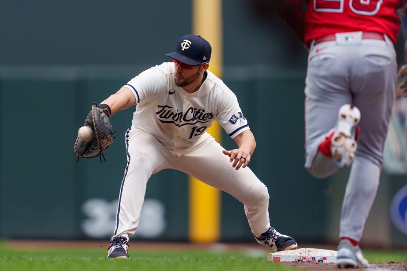 Sep 24, 2023; Minneapolis, Minnesota, USA; Minnesota Twins first baseman Alex Kirilloff (19) catches a throw by third baseman Jorge Polanco (11) retiring Los Angeles Angels first baseman Brandon Drury (23) at Target Field. Mandatory Credit: Matt Blewett-USA TODAY Sports