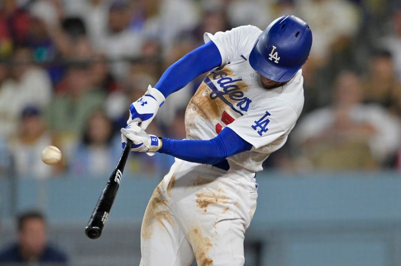 Aug 16, 2023; Los Angeles, California, USA;  Los Angeles Dodgers first baseman Freddie Freeman (5) doubles in a run in the sixth inning against the Milwaukee Brewers at Dodger Stadium. Mandatory Credit: Jayne Kamin-Oncea-USA TODAY Sports