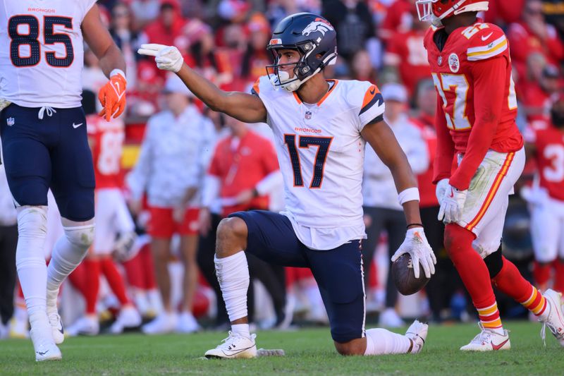 Denver Broncos wide receiver Devaughn Vele celebrates a first down catch during the second half of an NFL football game against the Kansas City Chiefs, Sunday, Nov. 10, 2024 in Kansas City, Mo. The Chiefs defeated the Broncos, 16-14. (AP Photo/Reed Hoffmann)