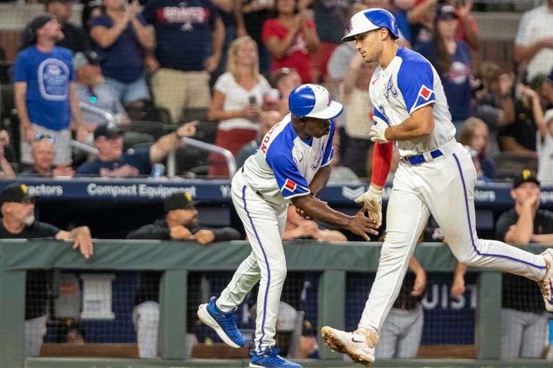 Sep 9, 2023; Cumberland, Georgia, USA; Atlanta Braves first baseman Matt Olson (28) high fives Atlanta Braves third base coach Ron Washington (37) after hitting home run in the seventh inning at Truist Park. Mandatory Credit: Jordan Godfree-USA TODAY Sports