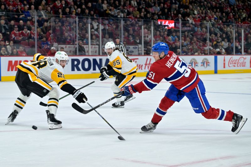 Oct 14, 2024; Montreal, Quebec, CAN; Montreal Canadiens forward Emil Heineman (51) scores a goal and Pittsburgh Penguins defenseman Marcus Pettersson (28) defends during the second period at the Bell Centre. Mandatory Credit: Eric Bolte-Imagn Images