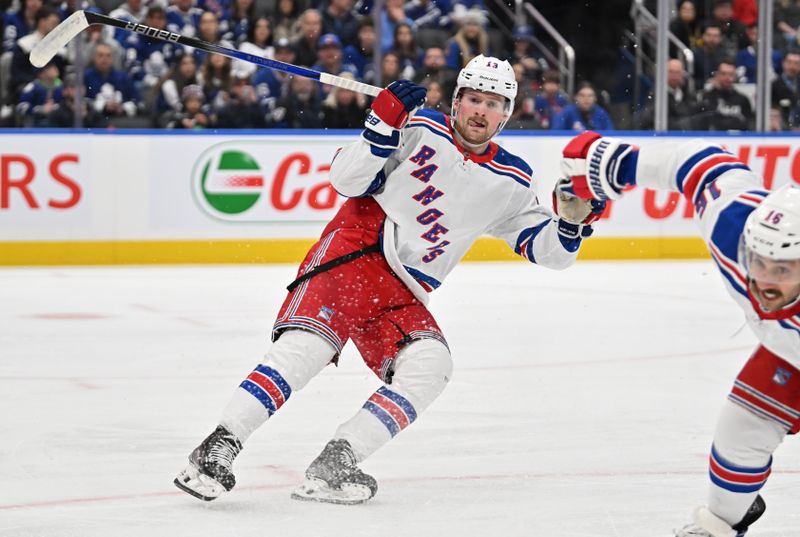 Mar 2, 2024; Toronto, Ontario, CAN;  New York Rangers forward Alexis Lafreniere (14) pursues the play against the Toronto Maple Leafs at Scotiabank Arena. Mandatory Credit: Dan Hamilton-USA TODAY Sports