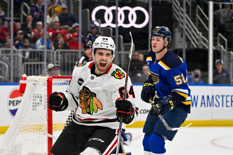 Apr 10, 2024; St. Louis, Missouri, USA;  Chicago Blackhawks left wing Landon Slaggert (84) reacts after scoring his first career NHL goal during the third period against the St. Louis Blues at Enterprise Center. Mandatory Credit: Jeff Curry-USA TODAY Sports