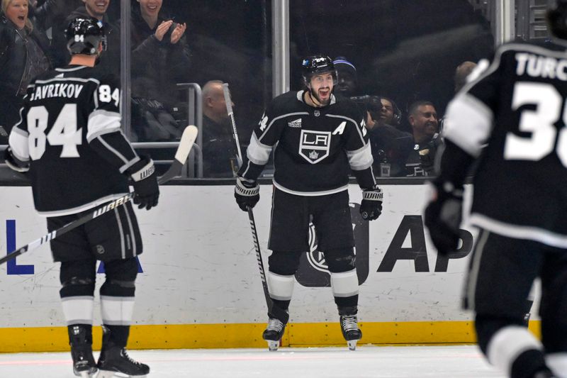 Mar 3, 2024; Los Angeles, California, USA;  Los Angeles Kings center Phillip Danault (24) celebrates after scoring a goal in the first period against the New Jersey Devils at Crypto.com Arena. Mandatory Credit: Jayne Kamin-Oncea-USA TODAY Sports