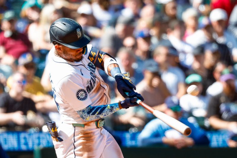 Aug 28, 2024; Seattle, Washington, USA; Seattle Mariners center fielder Julio Rodriguez (44) hits a two-run home run against the Tampa Bay Rays during the fifth inning at T-Mobile Park. Mandatory Credit: Joe Nicholson-USA TODAY Sports