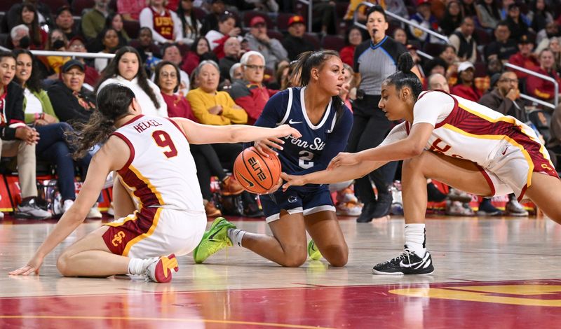 Jan 12, 2025; Los Angeles, California, USA; USC Trojans guards Kayleigh Heckel (9) and JuJu Watkins (12) try to grab the ball away from Penn State Nittany Lions guard Shaelyn Steele (2) during the third quarter at Galen Center. Mandatory Credit: Robert Hanashiro-Imagn Images