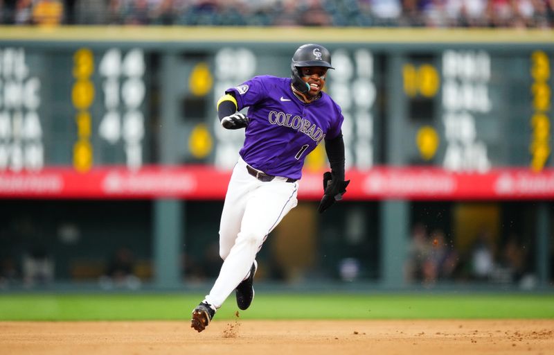 Jun 14, 2024; Denver, Colorado, USA; Colorado Rockies second base Adael Amador (1) heads to third base in the sixth inning against the Pittsburgh Pirates at Coors Field. Mandatory Credit: Ron Chenoy-USA TODAY Sports