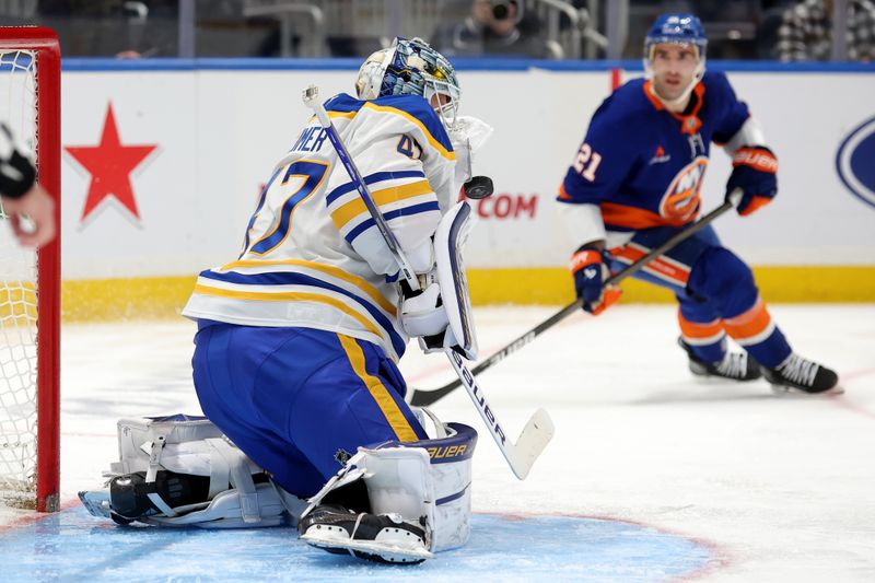 Nov 30, 2024; Elmont, New York, USA; Buffalo Sabres goaltender James Reimer (47) makes a save in front of New York Islanders center Kyle Palmieri (21) during the second period at UBS Arena. Mandatory Credit: Brad Penner-Imagn Images
