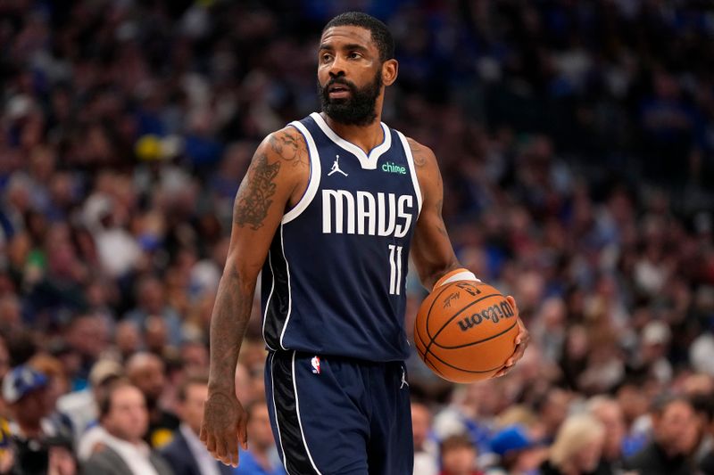 DALLAS, TEXAS - APRIL 05: Kyrie Irving #11 of the Dallas Mavericks controls the ball during the first half against the Golden State Warriors at American Airlines Center on April 05, 2024 in Dallas, Texas. NOTE TO USER: User expressly acknowledges and agrees that, by downloading and or using this photograph, User is consenting to the terms and conditions of the Getty Images License Agreement. (Photo by Sam Hodde/Getty Images)