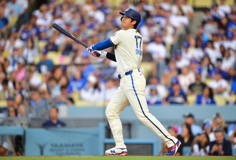 Jul 19, 2025; Los Angeles, California, USA; Los Angeles Dodgers designated hitter Shohei Ohtani (17) hits a two run home run during the third inning against the Milwaukee Brewers at Dodger Stadium. Mandatory Credit: Gary A. Vasquez-Imagn Images