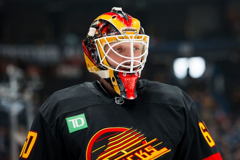 Jan 17, 2026; Vancouver, British Columbia, CAN; Vancouver Canucks goalie Nikita Tolopilo (60) skates  during warm ups prior to a game against the Edmonton Oilers at Rogers Arena. Mandatory Credit: Bob Frid-Imagn Images