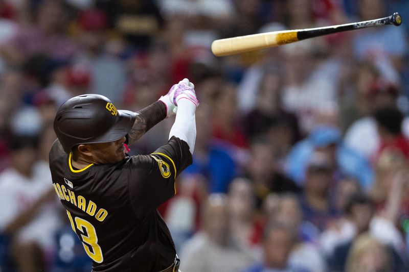 Jun 18, 2024; Philadelphia, Pennsylvania, USA; San Diego Padres third base Manny Machado (13) loose grip on his bat while batting during the ninth inning against the Philadelphia Phillies at Citizens Bank Park. Mandatory Credit: Bill Streicher-USA TODAY Sports