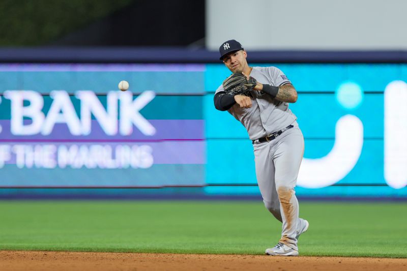 Aug 11, 2023; Miami, Florida, USA; New York Yankees second baseman Gleyber Torres (25) throws to first base to retire Miami Marlins third baseman Jake Burger (not pictured) during the sixth inning at loanDepot Park. Mandatory Credit: Sam Navarro-USA TODAY Sports