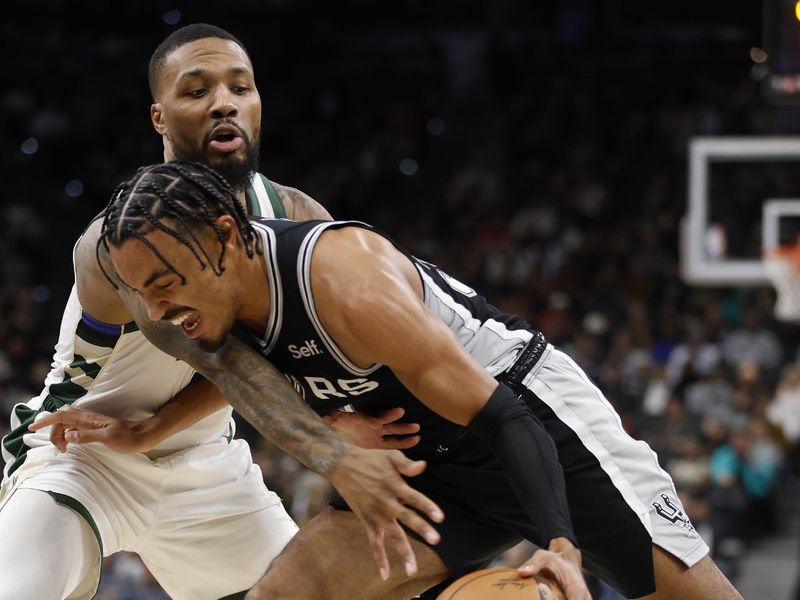 SAN ANTONIO, TX - JANUARY  04:  Tre Jones #33 of the San Antonio Spurs drives past Damian Lillard #0 of the Milwaukee Bucks in the first half at Frost Bank Center on January  04, 2024 in San Antonio, Texas. NOTE TO USER: User expressly acknowledges and agrees that, by downloading and or using this photograph, User is consenting to terms and conditions of the Getty Images License Agreement. (Photo by Ronald Cortes/Getty Images)