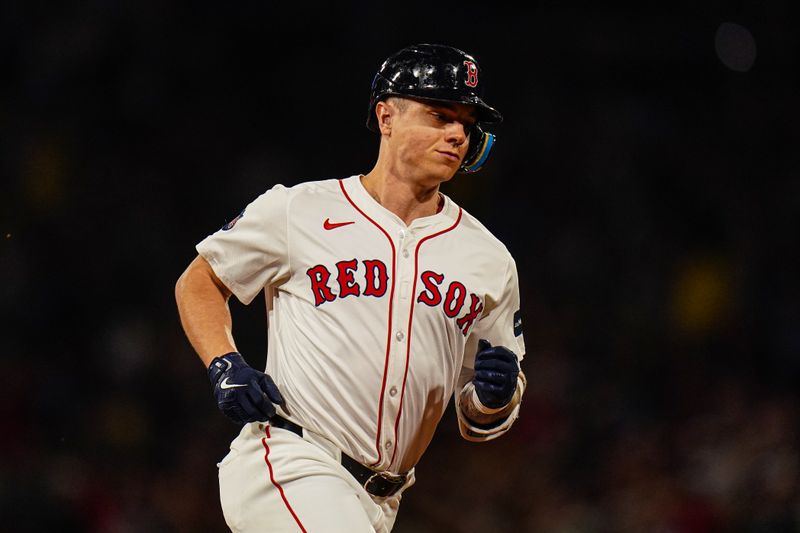 Sep 9, 2024; Boston, Massachusetts, USA; Boston Red Sox designated hitter Tyler O'Neill (17) hits a home run against the Baltimore Orioles in the third inning at Fenway Park. Mandatory Credit: David Butler II-Imagn Images