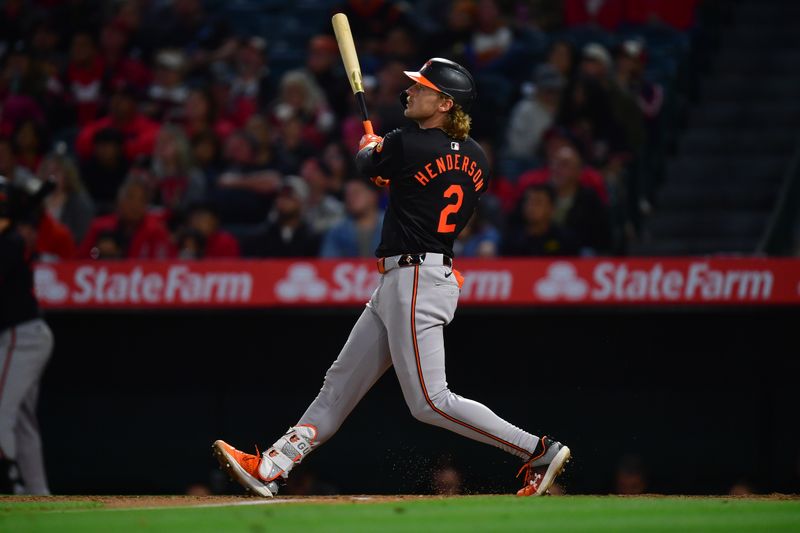 Apr 23, 2024; Anaheim, California, USA; Baltimore Orioles shortstop Gunnar Henderson (2) hits a solo home run against the Los Angeles Angels during the seventh inning at Angel Stadium. Mandatory Credit: Gary A. Vasquez-USA TODAY Sports