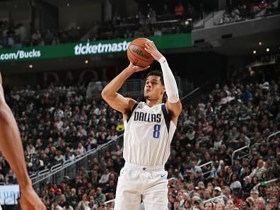 MILWAUKEE, WI - NOVEMBER 18: Josh Green #8 of the Dallas Mavericks shoots the ball during the game against the Milwaukee Bucks on November 18, 2023 at the Fiserv Forum Center in Milwaukee, Wisconsin. NOTE TO USER: User expressly acknowledges and agrees that, by downloading and or using this Photograph, user is consenting to the terms and conditions of the Getty Images License Agreement. Mandatory Copyright Notice: Copyright 2023 NBAE (Photo by Gary Dineen/NBAE via Getty Images).