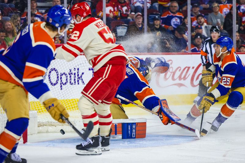 Jan 20, 2024; Calgary, Alberta, CAN; Calgary Flames defenseman MacKenzie Weegar (52) scores a goal against Edmonton Oilers goaltender Stuart Skinner (74) during the second period at Scotiabank Saddledome. Mandatory Credit: Sergei Belski-USA TODAY Sports