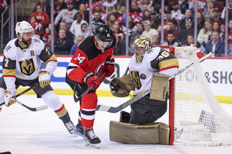 Jan 22, 2024; Newark, New Jersey, USA; Vegas Golden Knights goaltender Logan Thompson (36) makes a save in front of New Jersey Devils right wing Nathan Bastian (14) and defenseman Alex Pietrangelo (7) during the first period at Prudential Center. Mandatory Credit: Vincent Carchietta-USA TODAY Sports