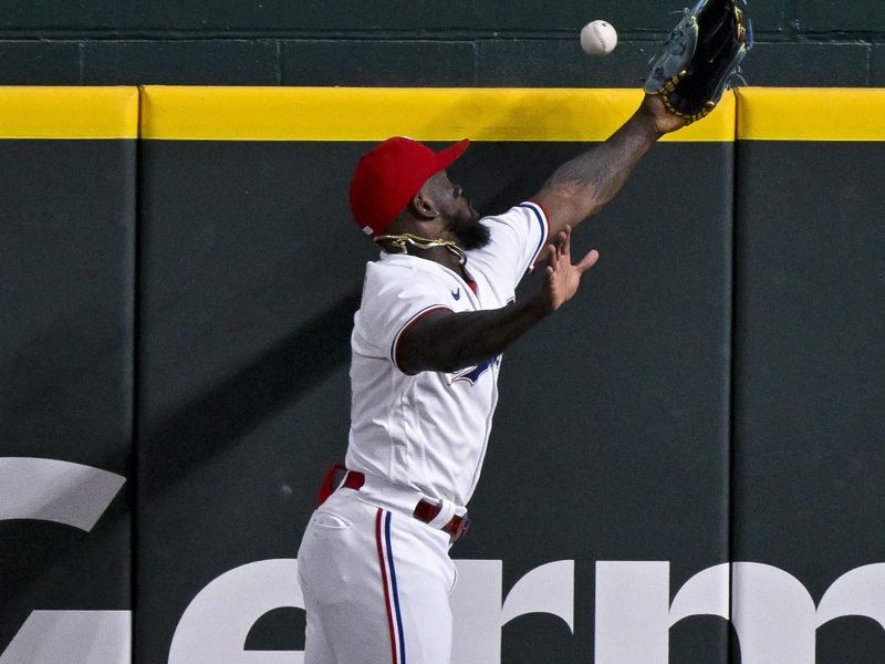 May 16, 2023; Arlington, Texas, USA; Texas Rangers right fielder Adolis Garcia (53) leaps but cannot catch a home run ball hit by Atlanta Braves catcher Sean Murphy (not pictured) during the eighth inning at Globe Life Field. Mandatory Credit: Jerome Miron-USA TODAY Sports