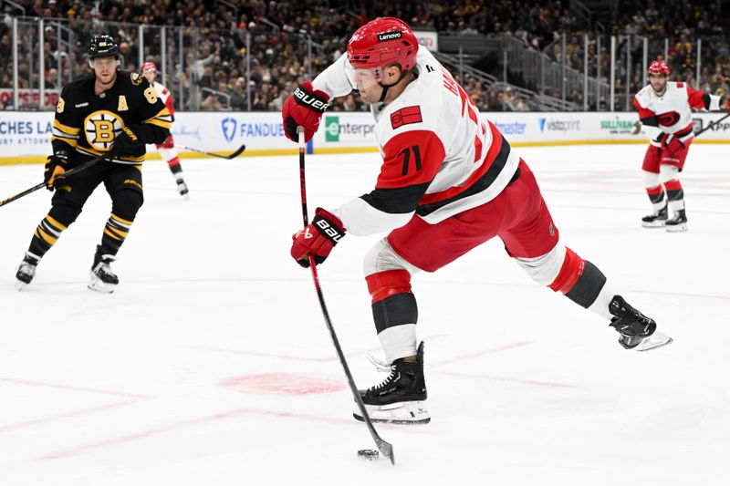 Nov 17, 2025; Boston, Massachusetts, USA; Carolina Hurricanes left wing Taylor Hall (71) attempts a shot against the Boston Bruins during the second period at the TD Garden. Mandatory Credit: Brian Fluharty-Imagn Images