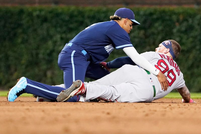 Jul 14, 2023; Chicago, Illinois, USA; Boston Red Sox right fielder Alex Verdugo (99) steals second base as Chicago Cubs second baseman Christopher Morel (5) takes a late throw during the third inning at Wrigley Field. Mandatory Credit: David Banks-USA TODAY Sports