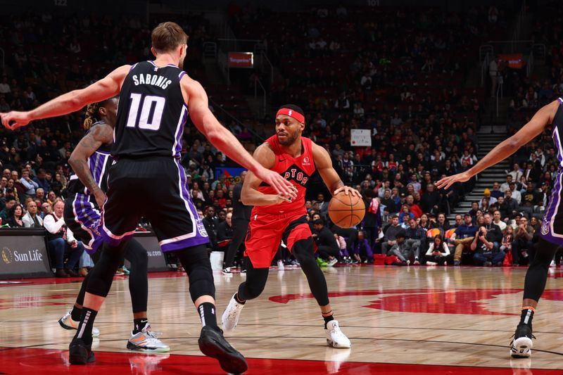 TORONTO, CANADA - MARCH 20: Bruce Brown #11 of the Toronto Raptors dribbles the ball during the game against the Sacramento Kings on March 20, 2024 at the Scotiabank Arena in Toronto, Ontario, Canada.  NOTE TO USER: User expressly acknowledges and agrees that, by downloading and or using this Photograph, user is consenting to the terms and conditions of the Getty Images License Agreement.  Mandatory Copyright Notice: Copyright 2024 NBAE (Photo by Vaughn Ridley/NBAE via Getty Images)