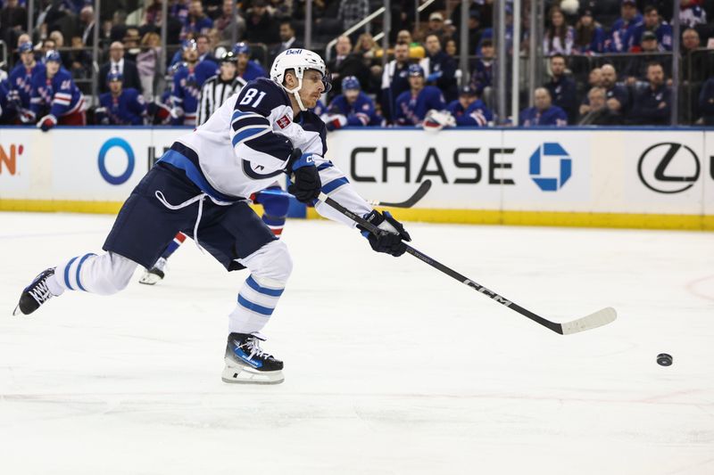 Nov 12, 2024; New York, New York, USA; Winnipeg Jets left wing Kyle Connor (81) attempts a shot on goal in the first period against the New York Rangers at Madison Square Garden. Mandatory Credit: Wendell Cruz-Imagn Images