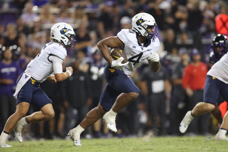 Sep 30, 2023; Fort Worth, Texas, USA; West Virginia Mountaineers running back CJ Donaldson Jr. (4) runs the ball in the fourth quarter against the TCU Horned Frogs at Amon G. Carter Stadium. Mandatory Credit: Tim Heitman-USA TODAY Sports