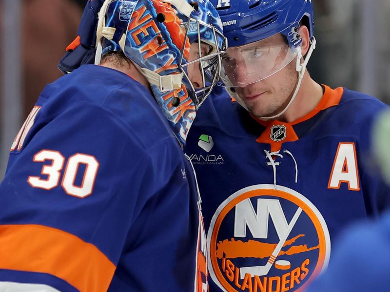 Dec 2, 2025; Elmont, New York, USA; New York Islanders center Bo Horvat (14) and goaltender Ilya Sorokin (30) celebrate after defeating the Tampa Bay Lightning at UBS Arena. Mandatory Credit: Brad Penner-Imagn Images