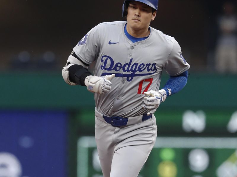 Jun 5, 2024; Pittsburgh, Pennsylvania, USA;  Los Angeles Dodgers designated hitter Shohei Ohtani (17) circles the bases on a two run home run against the Pittsburgh Pirates during the third inning at PNC Park. Mandatory Credit: Charles LeClaire-USA TODAY Sports