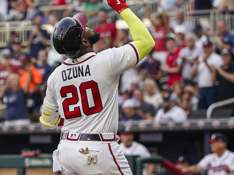 Aug 15, 2023; Cumberland, Georgia, USA; Atlanta Braves designated hitter Marcell Ozuna (20) reacts after hitting a two run home run against the New York Yankees during the first inning at Truist Park. Mandatory Credit: Dale Zanine-USA TODAY Sports