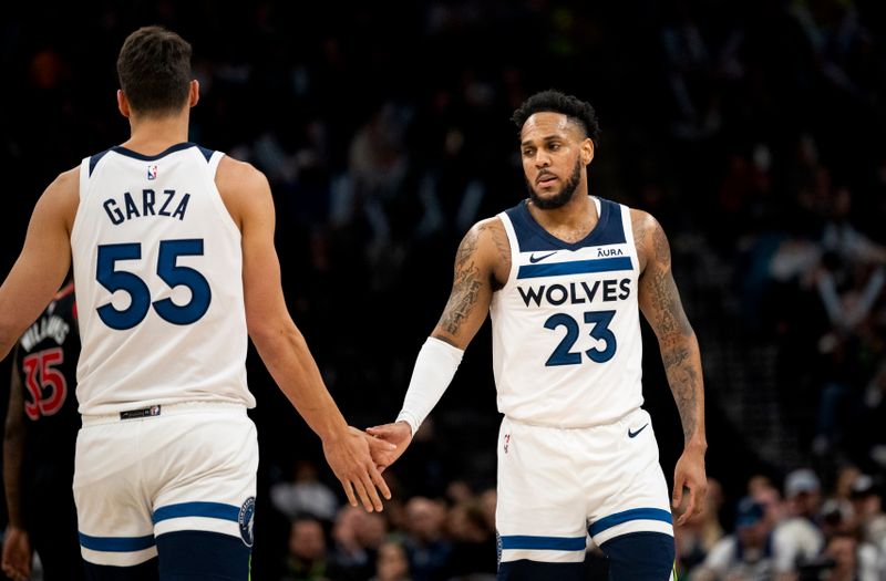 MINNEAPOLIS, MINNESOTA - APRIL 3: Monte Morris #23 of the Minnesota Timberwolves celebrates with Luka Garza #55 after a play in the fourth quarter of the game against the Toronto Raptors at Target Center on April 3, 2024 in Minneapolis, Minnesota. NOTE TO USER: User expressly acknowledges and agrees that, by downloading and or using this photograph, User is consenting to the terms and conditions of the Getty Images License Agreement. (Photo by Stephen Maturen/Getty Images)